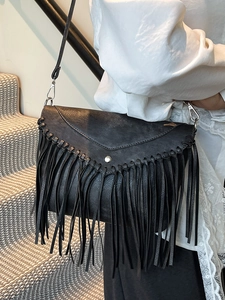 Vintage black bohemian fringe envelope crossbody bag with metal buckle and long tassels