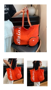 Détail du sac fourre-tout orange vif avec texte voyage et pochette à monnaie ronde