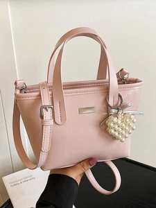 Pink macaron bucket bag with pearl heart charm and adjustable strap for women