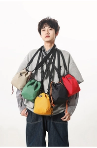 Detail of five-color checkered drawstring crossbody bags with adjustable straps