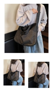 Detail of dark grey washed fabric tote bag with spacious interior and wide shoulder strap