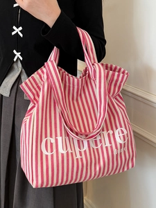 Pink and white striped canvas tote bag with lettering for students and commuting
