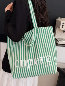 Green and white striped canvas tote bag with Cupere Dune text for women's daily commute