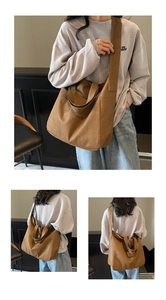 Detail view of large canvas tote bag with wide strap and brown canvas texture