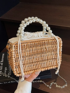 French woven straw handbag with large pearl handles and silver metal chain strap