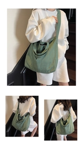 Detail of green canvas tote bag showing its large capacity and dual-handle shoulder design