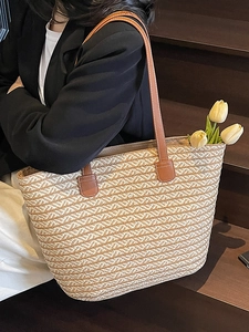 Minimalist straw tote bag with geometric texture and brown leather straps for summer