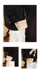 Detailed shot of beige leather crossbody bag with chic tassel and colorful woven strap