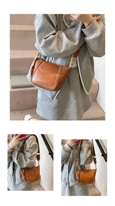 Detail of caramel leather crossbody bag with geometric pattern wide strap and gold hardware
