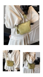 Detail view of grass green faux leather crossbody bag with ethnic embroidered wide strap