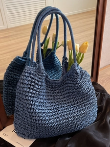 Handwoven navy blue straw tote bag with half-moon shape for summer beach vacation style