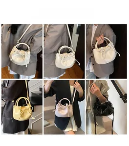 Detail view of Korean style oil wax leather bucket bag with bow drawstring in four colors