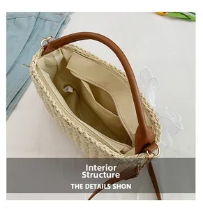 Detail view of woven straw bag interior showing zipper pocket and soft fabric lining