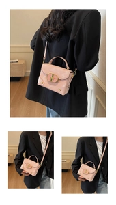 Detailed view of the shiny pink patent leather box bag with gold metal buckle and rivets