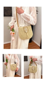 Detailed close-up of woven straw bag featuring bohemian fringe and colorful bead embroidery