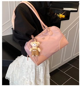 Pink retro nylon pillow bag with leather corners and cute teddy bear charm
