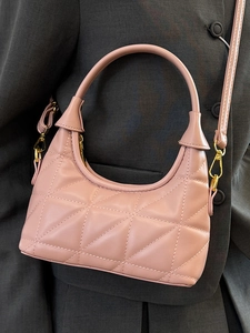 Elegant quilted rose pink underarm bag with geometric texture and gold twist lock