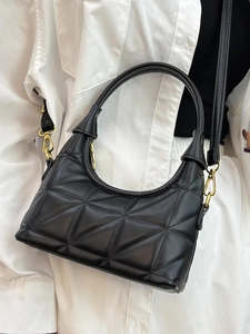 Chic black quilted leather underarm bag with gold hardware and versatile crossbody strap