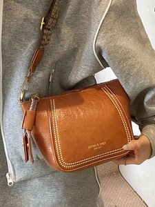 French retro brown leather dumpling bag with decorative rivets and wide woven strap