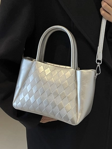 Silver quilted metallic bucket bag with top handle and crossbody strap for women