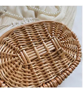 Detailed close-up of handmade straw woven texture with white cotton drawstring lining