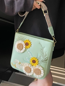 Light green bucket bag with 3D sunflower embroidery and ethnic woven shoulder strap