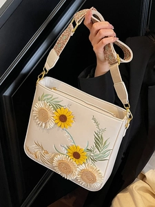 White leather bucket bag with sunflower 3D embroidery and bohemian woven shoulder strap