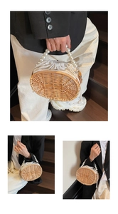 Detailed close-up of woven straw bag with white pearl bead handle and drawstring insert