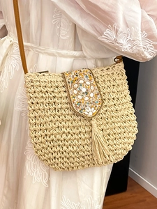 Bohemian woven straw crossbody bag with colorful beads and tassels for vacation