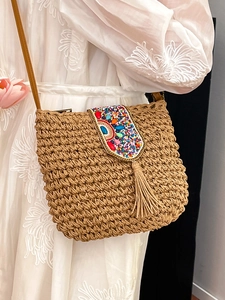 Bohemian handwoven straw crossbody bag with colorful bead embroidery and tassels