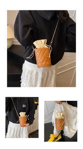 Detailed views of the brown quilted bucket bag with gold chain strap and drawstring closure