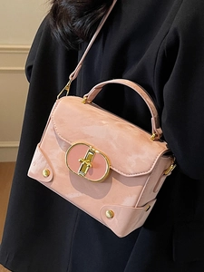 Pink marble-textured leather crossbody box bag with gold metal buckle and handle