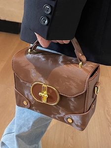 Brown marble pattern handbag with golden metal clasp and crossbody strap for women