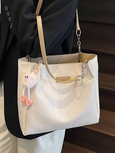 Chic beige tote bag with wavy texture and pink monster charm for women casual daily use