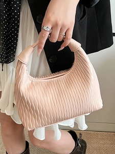 Pink minimalist pleated dumpling bag for women with a hobo style and top handle design