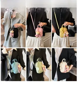 Detailed grid view of six vibrant mini crossbody bags with cute bear charm and smiley tag