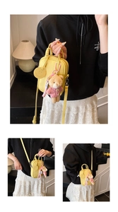 Detail view of yellow crossbody bag with cute plush bear and smiley face charms
