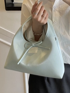 French style light green dumpling handbag with bow detail and elegant chain strap