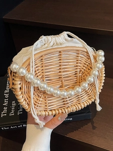 Handmade woven rattan handbag with pearl bead handle and drawstring canvas inner bag