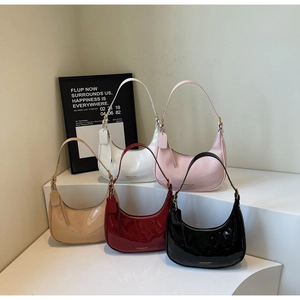 Five assorted glossy leather crescent underarm bags in white, pink, khaki, red, and black