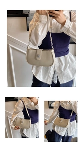 Detail of beige oil wax leather hobo bag with silver buckle and adjustable shoulder strap