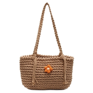 Knitted summer tote bag with woven flower and tassels for beach vacations