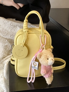 Minimalist yellow litchi pattern leather crossbody bag with a teddy bear charm