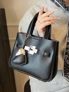 Minimalist black litchi texture bucket bag with silver lock and heart charm