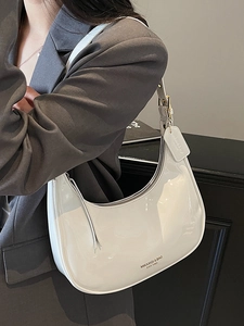 White patent leather hobo bag for women with adjustable strap and metallic logo detail