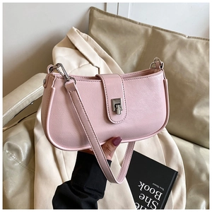 Detail shot of pink oil wax leather underarm bag featuring a silver metal buckle clasp