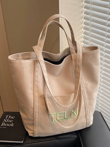Large beige canvas tote bag with green TELN embroidery for daily commute and students