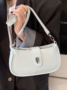 Light blue oil wax leather underarm bag with silver buckle and adjustable shoulder strap