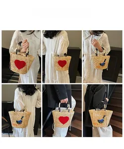 Detail shots of straw beach tote with heart embroidery and stylish woven handles