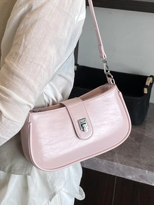 Minimalist light pink wax leather underarm bag with silver buckle and adjustable strap
